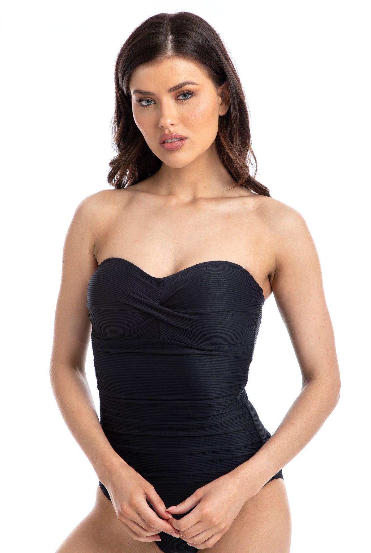 Woman wearing a black ribbed texture bandeau one piece swimsuit, worn strapless